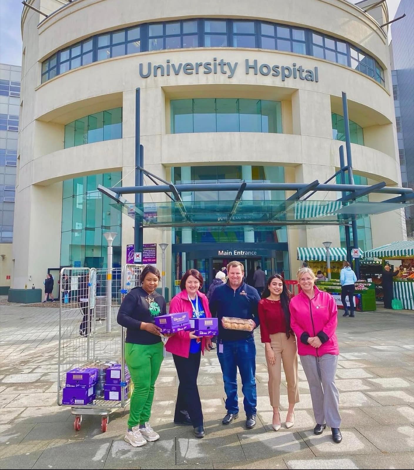 AOG team members with hospital staff at Coventry University Hospital, delivering an Easter donation for patients and their families