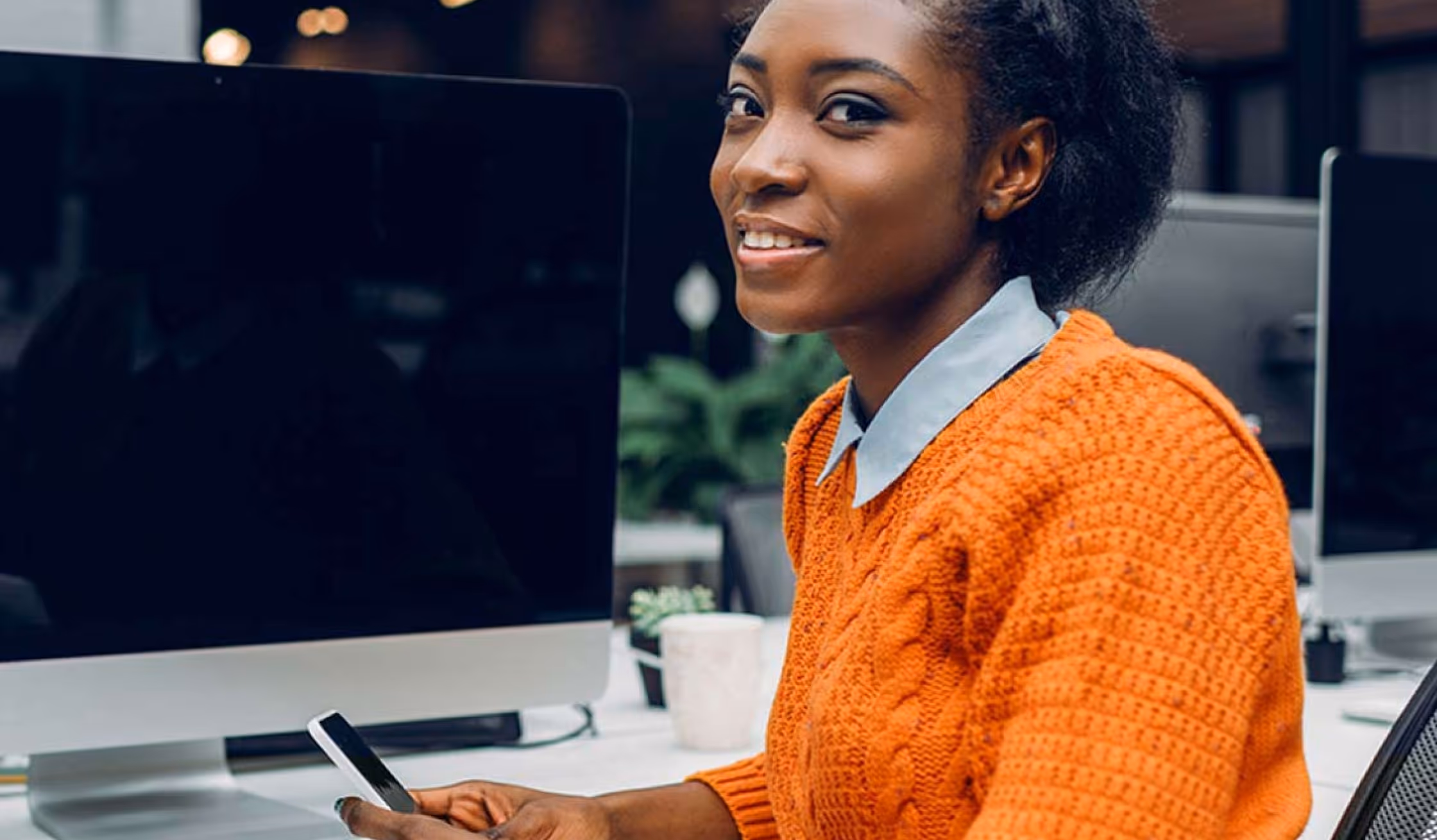 AOG team member at a desk, ready to take your enquiry